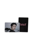 Two cards, one with a black background and 'LION' text, the other with a portrait of a person, on a light gray surface.