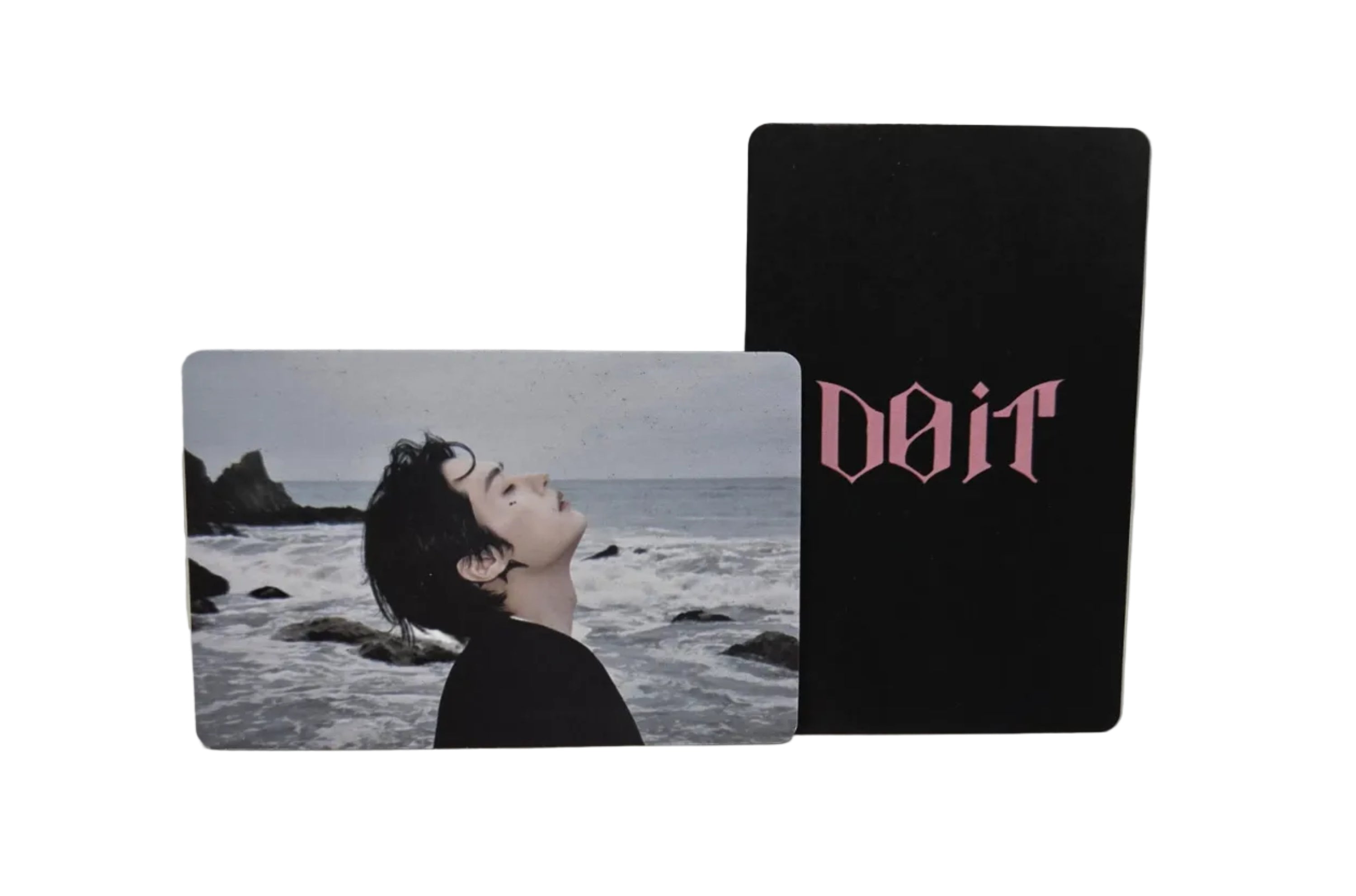 Two cards stacked on a light gray surface, one with text and the other with a person.