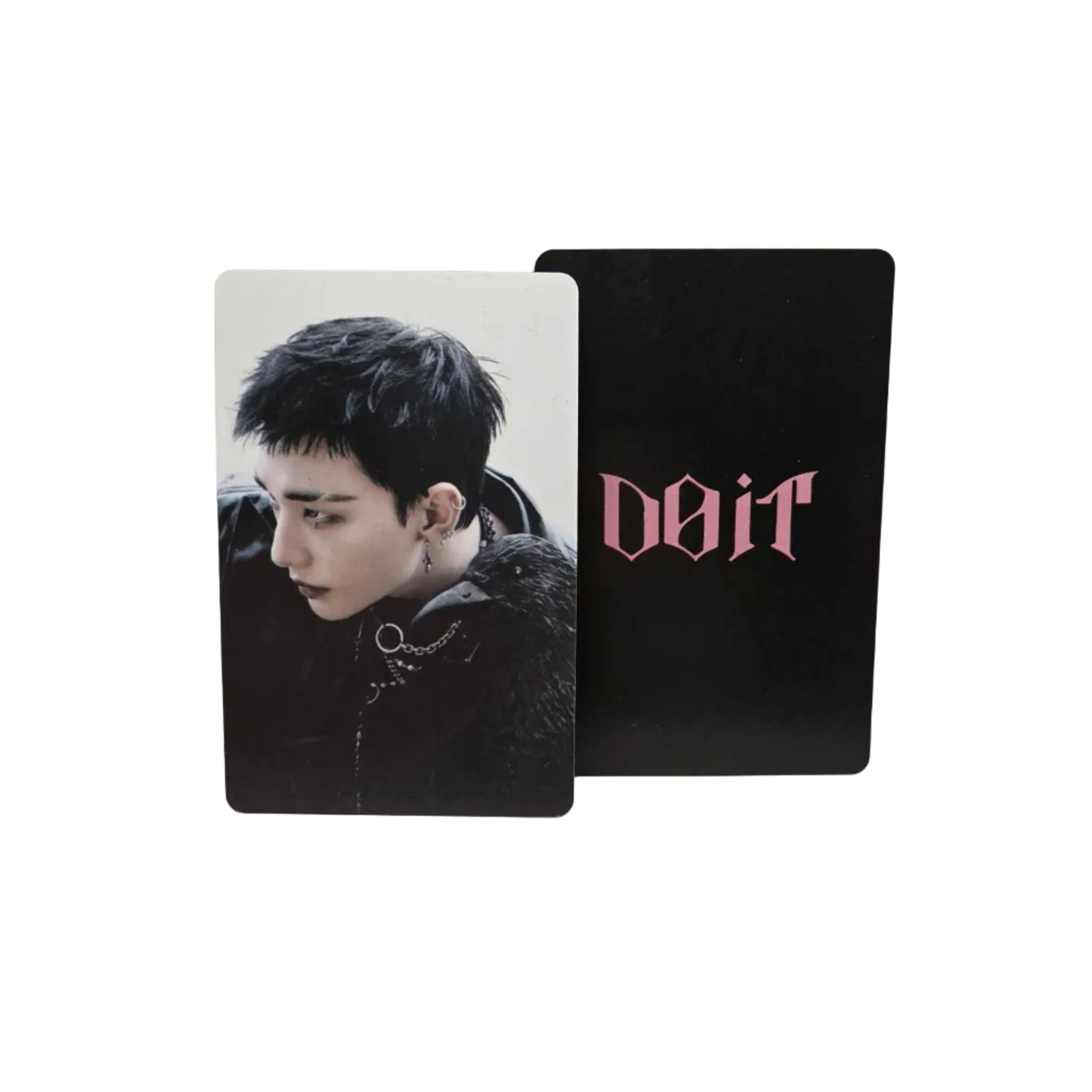 Two cards, one with a black background and 'DOIT' text, the other with a photo of a person, on a light gray surface.