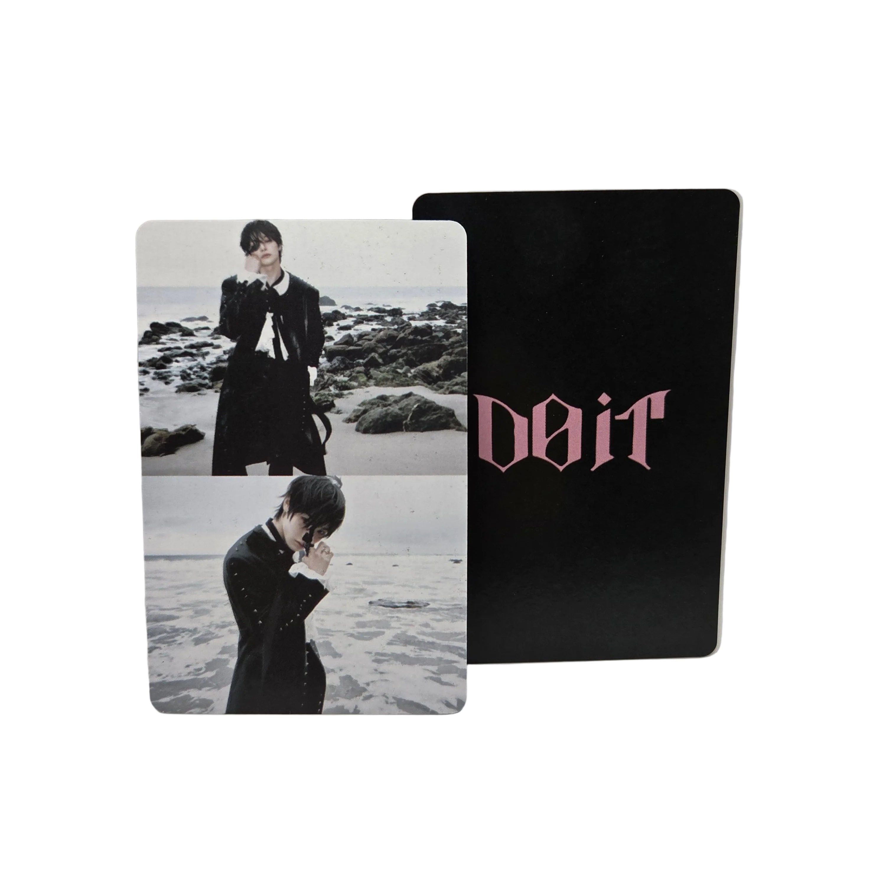Two cards with a black card featuring pink text and a photo card with two people on a beach.