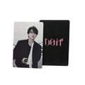 Two cards, one with a black background and 'Dior' logo, the other with a photo of a person, on a light gray surface.
