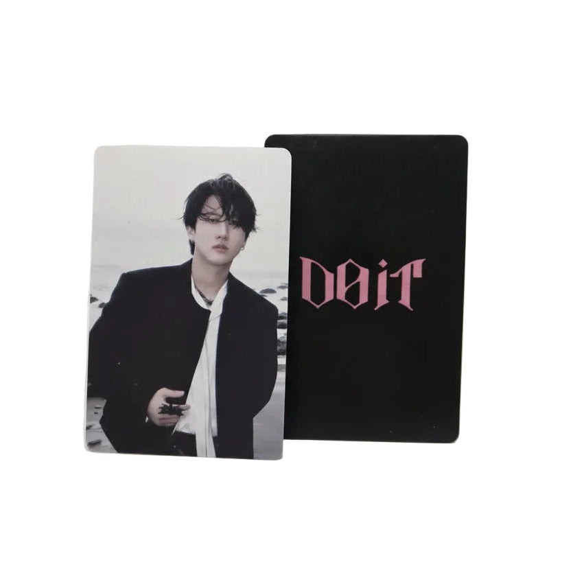 Two cards, one with a black background and 'Dior' logo, the other with a photo of a person, on a light gray surface.