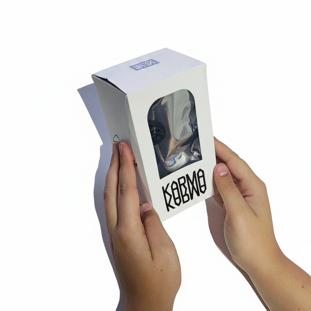 Person holding a white box with a brand logo on a light surface