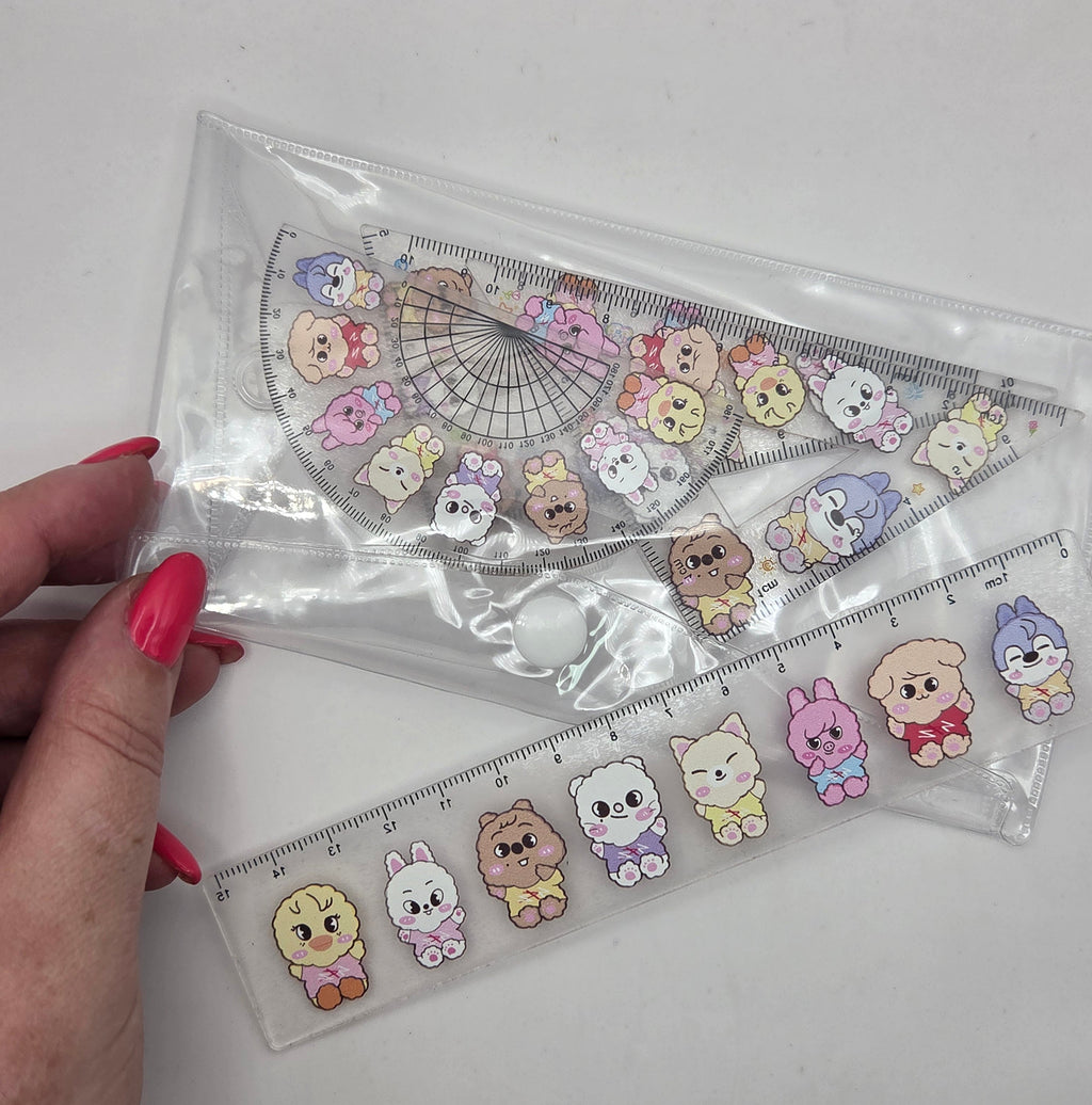 Set of geometric shapes with cartoon bear designs in a clear plastic case.