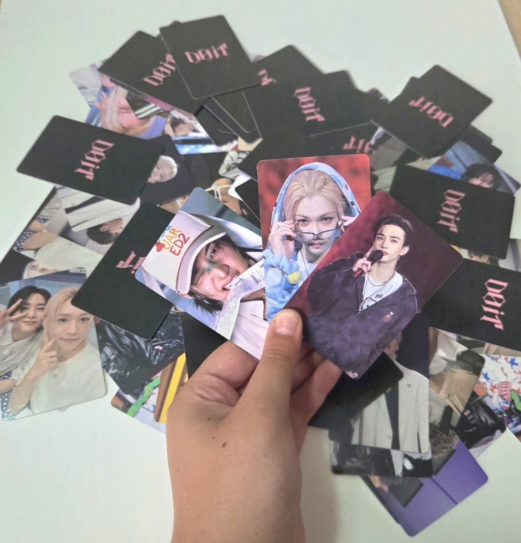 Collection of photo cards featuring various images on a white surface