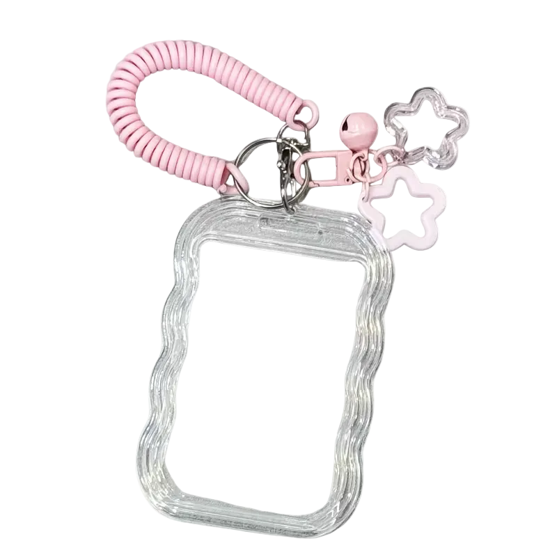 Clear phone case with pink keychain and star charm on a white background