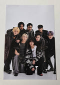 Group photo of people in formal attire on a white background