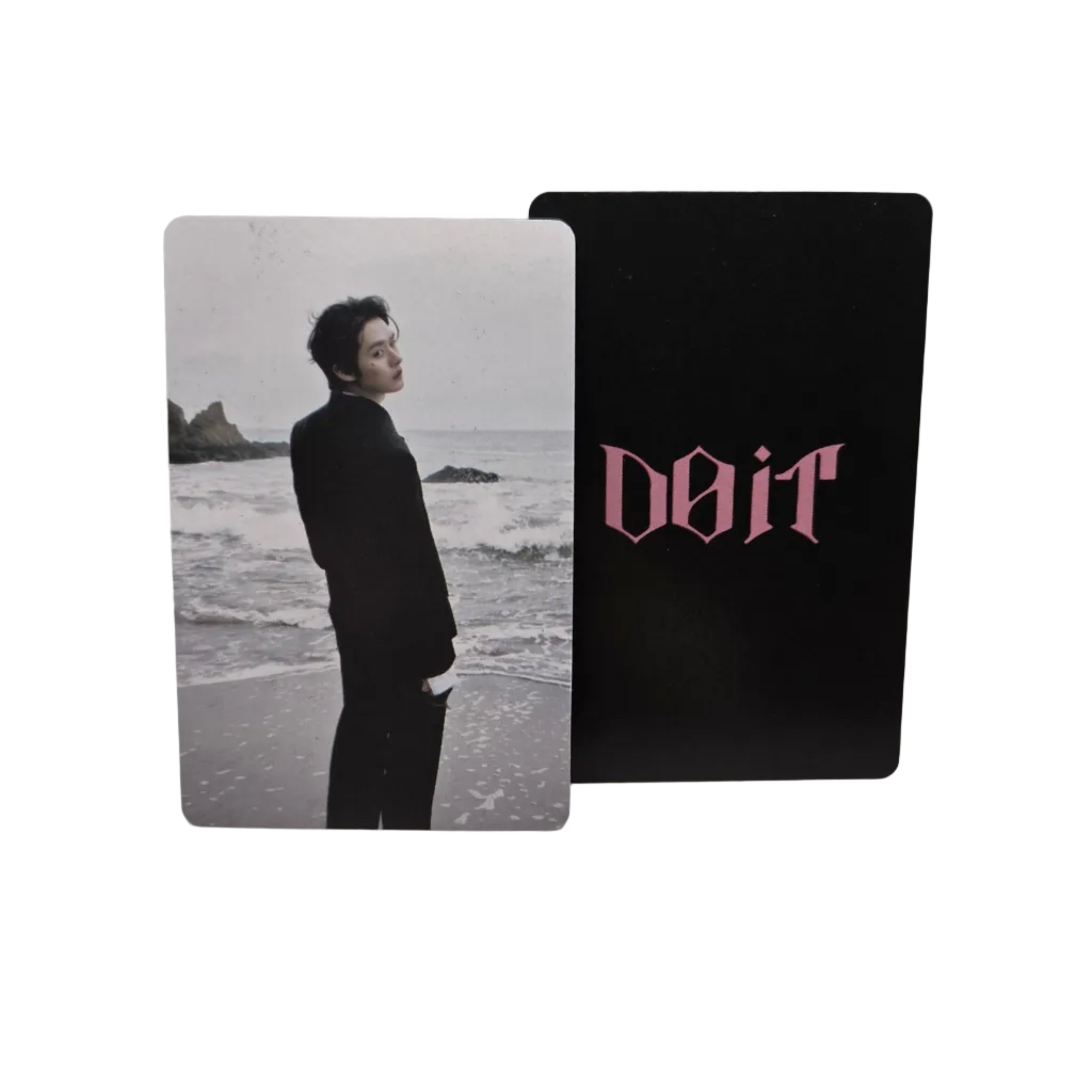 Two cards stacked on a light gray surface, one with text and the other with a photo of a person.